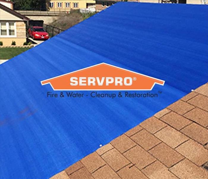 tarped roof with SP logo